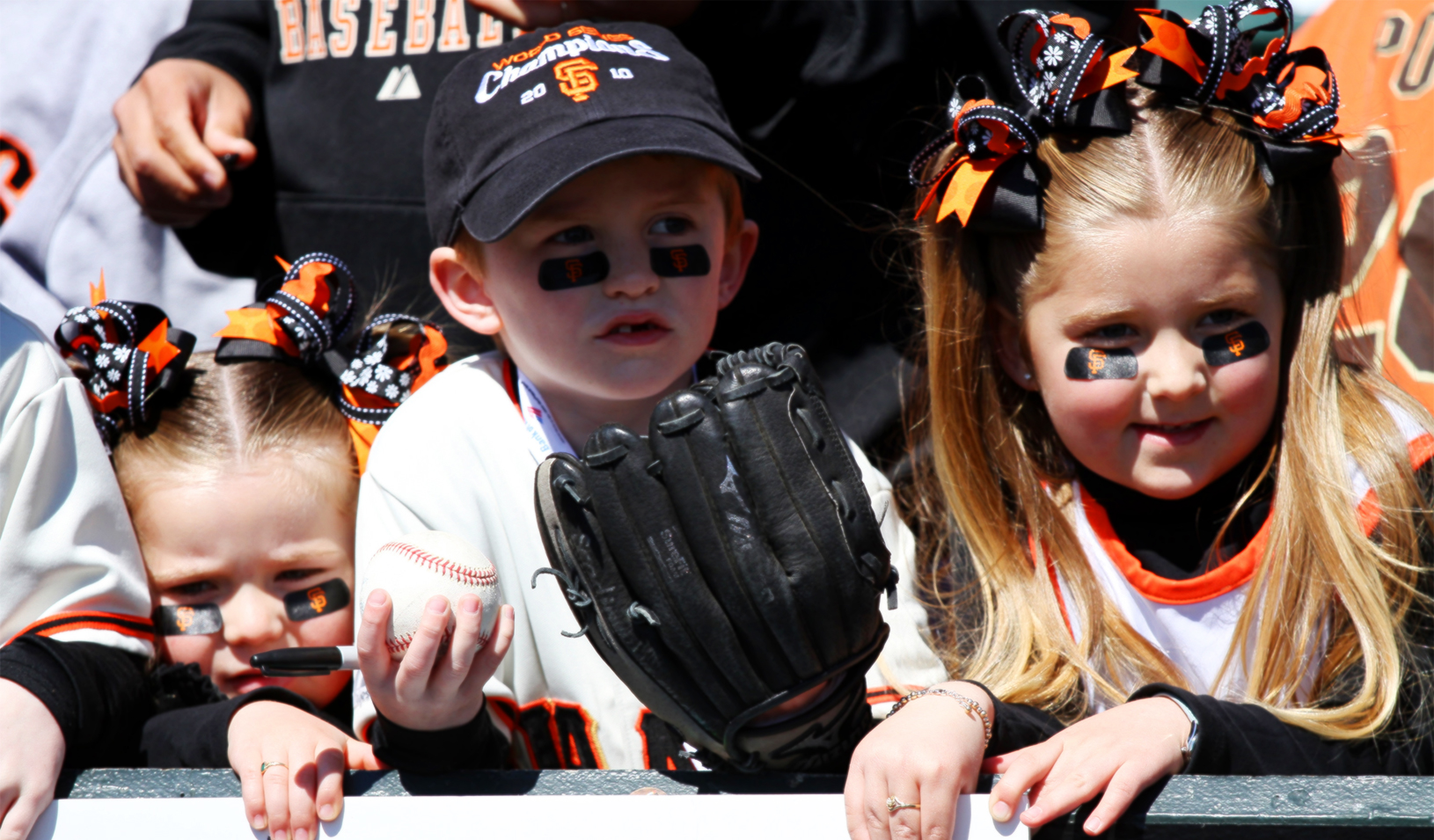 Three children decked out in San Francisco Giants gear | Reuters/Beck Diefenbach