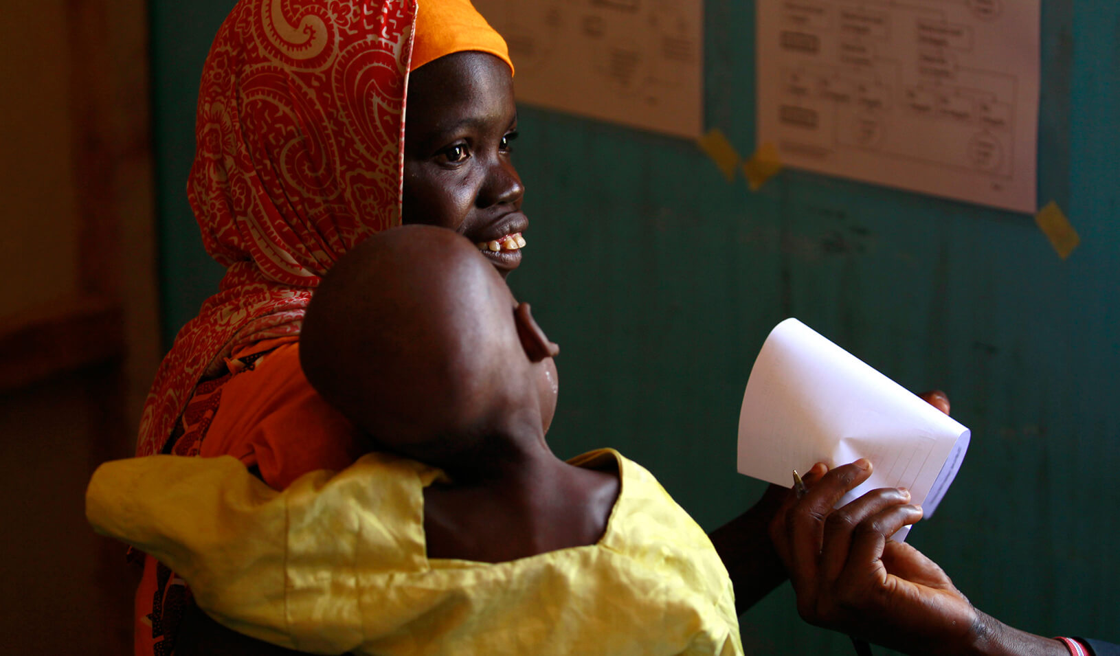 A woman waits with her child in clinic operated by Doctors without Borders in Zamfara | Reuters/Akintunde Akinleye