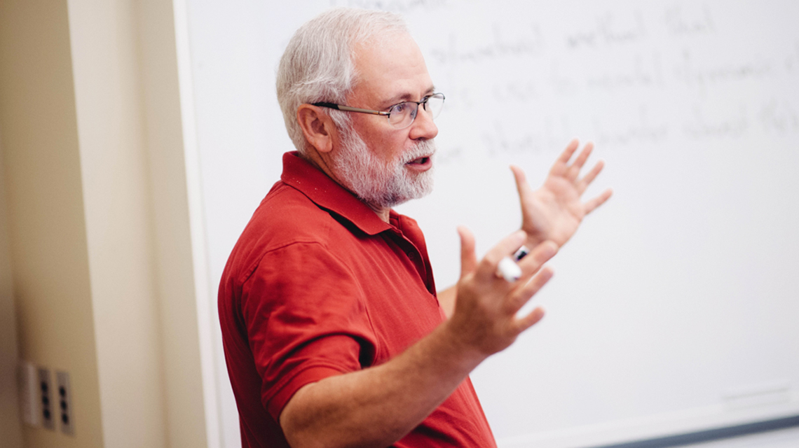 Professor Kreps, Professor of Economics teaching a class