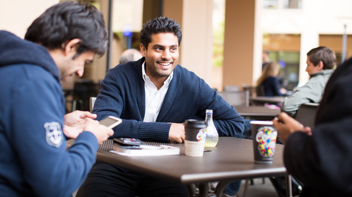 students meeting for coffee at TA Associates’ Café