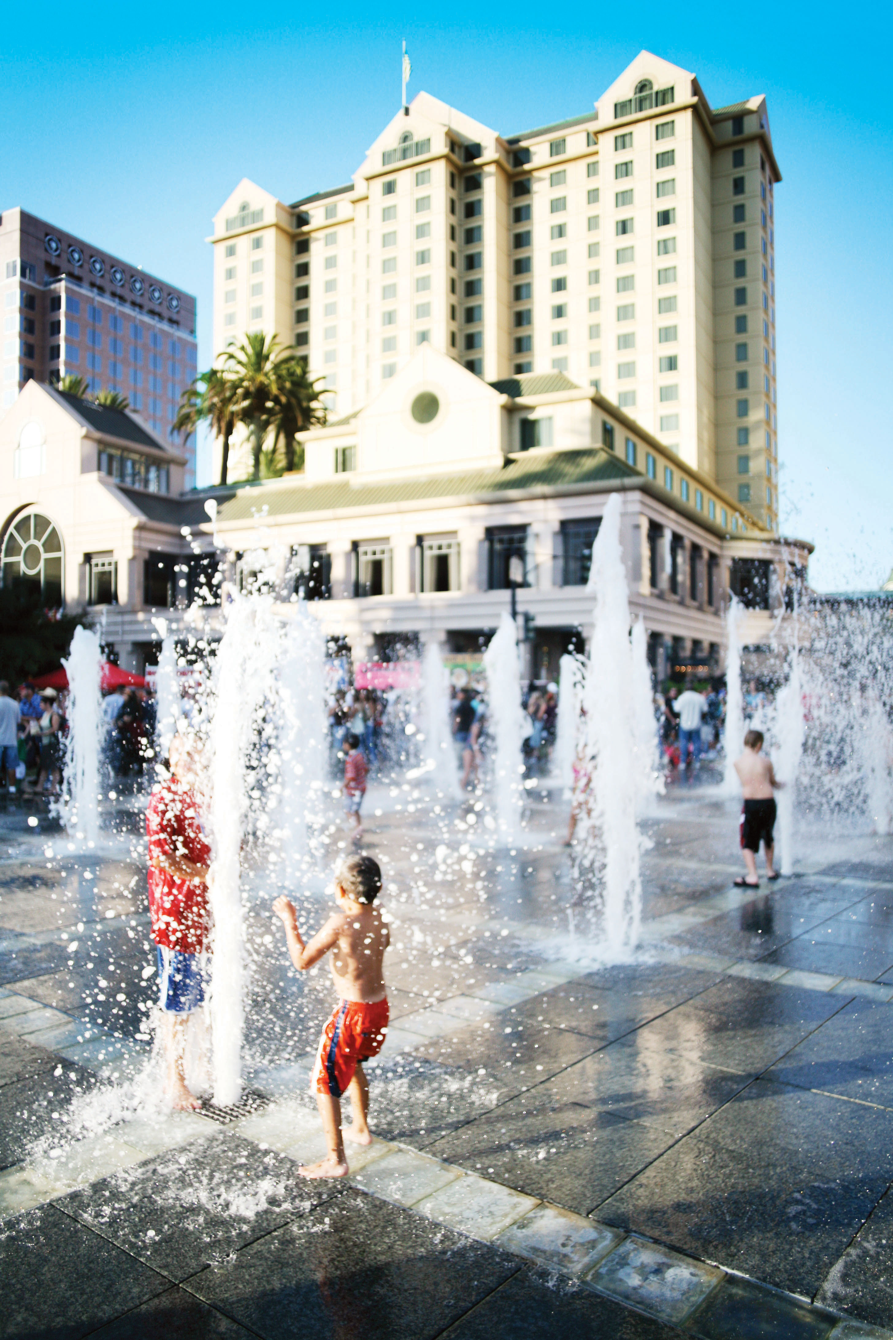 Kids playing in fountains