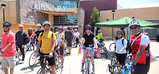 Helmeted bicyclist gearing up for the 2015 Gira de Libro ride