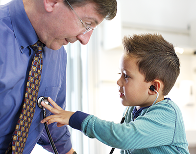 Dr. Roth and young both with stethescope