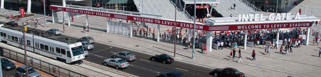 Banner image of light rail train passing Levi Stadium, which is under construction