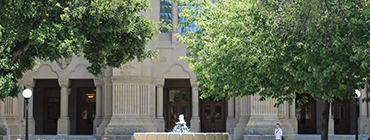 building, water fountain and trees