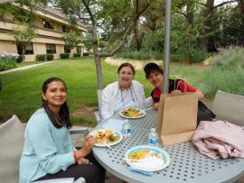 Attendees eating at the Stanford Staffers Potluck 2015