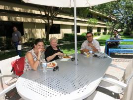Attendees eating at Staff Groups Summer Potluck July 2014