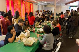 Attendees eating lunch at ASF's Diwali-Festival of Lights celebration 2014