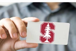 Student Holding Stanford Cardinal Card