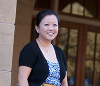 photo of Cindy Cho standing next to a building