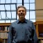 Henry Lowood in front of a window in the library