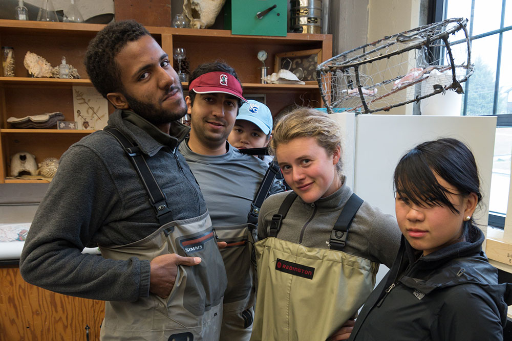 The students don waders in preparation for a hands-on course about Alaska's salmon fisheries