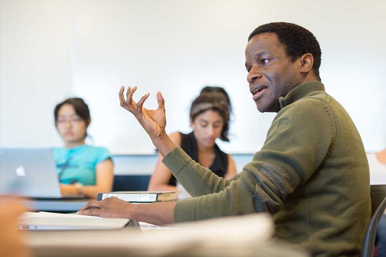 Alvan Ikoku speaking in a classroom