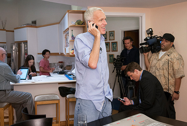 Nobel Prize winner Brian Kobilka answers calls from reporters at his home this morning.