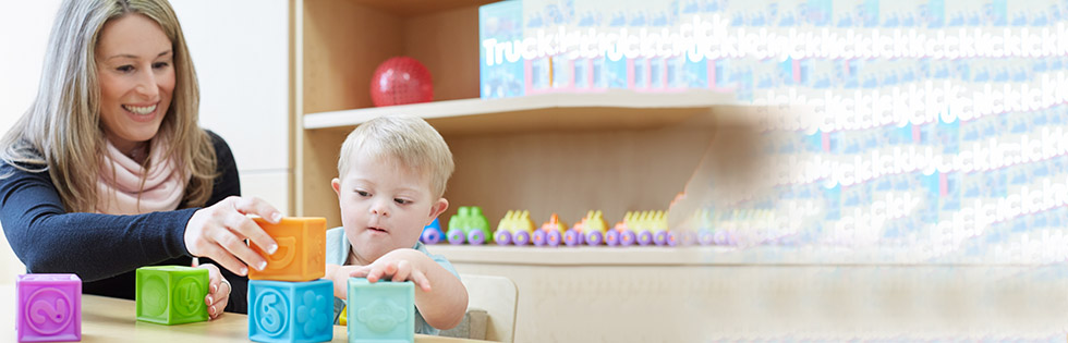 Therpist with young patients using blocks