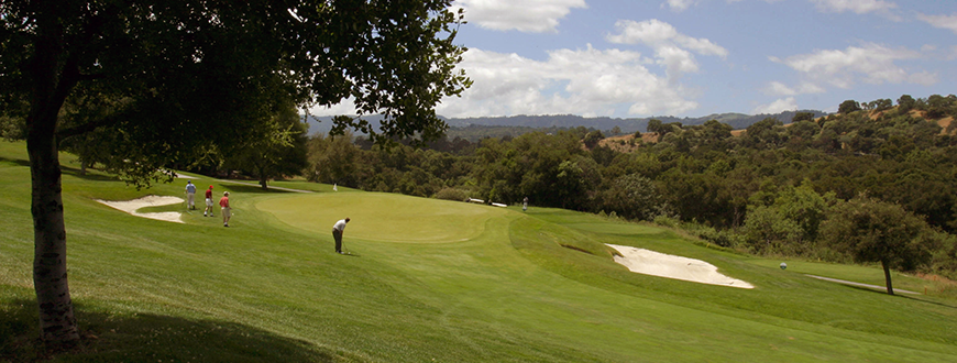 Golfers playing 18 holes on a sunny day at the Stanford Golf Course.