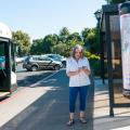 woman checking her phone at Marguerite stop