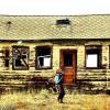 woman in front of a house