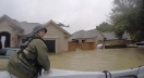 rescuer in boat in Houston flooding