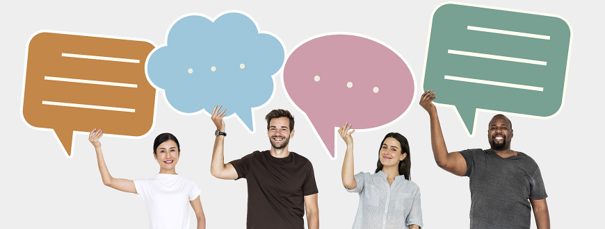 four people holding large speech bubbles