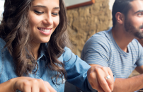 Female and male enjoying meal in cafeteria