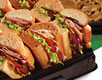 Subway catering tray with delicious sub sandwiches and fresh cookies