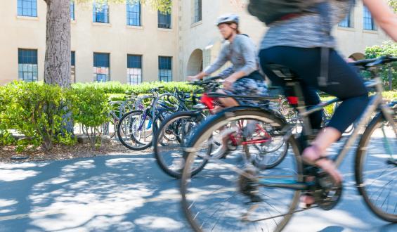 two people passing each other on bikes