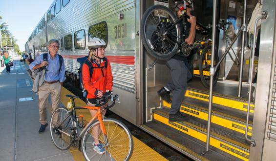 cyclists loading bikes on Caltrain