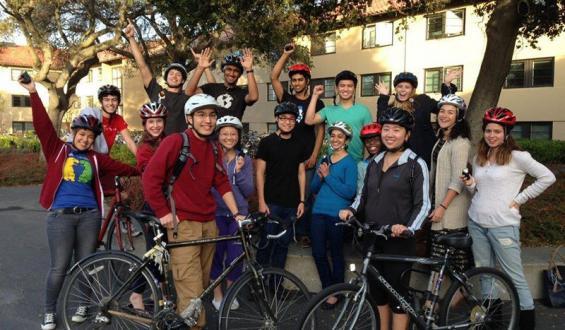 group of cyclists celebrating