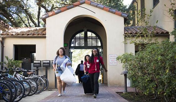 students walking outside dorm during orientation