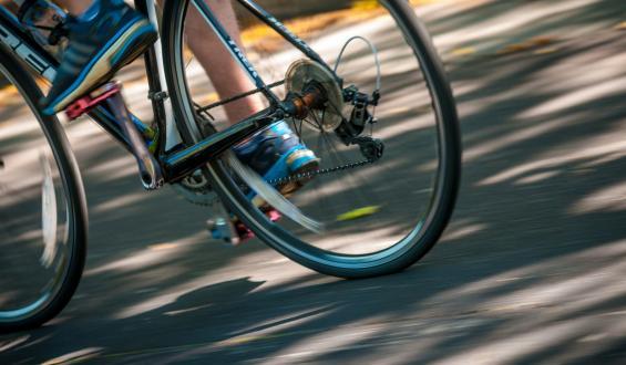 Zoomed in picture of a bike riders rear tires