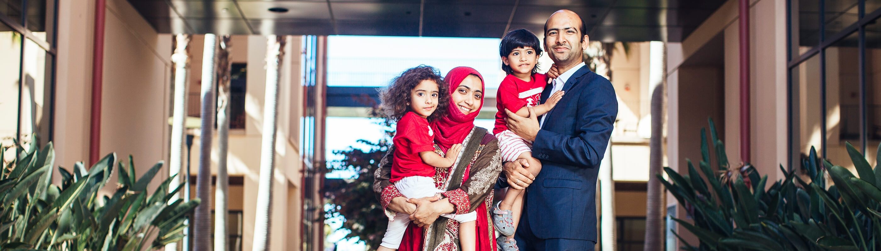 an MSx student with his wife and two daughters