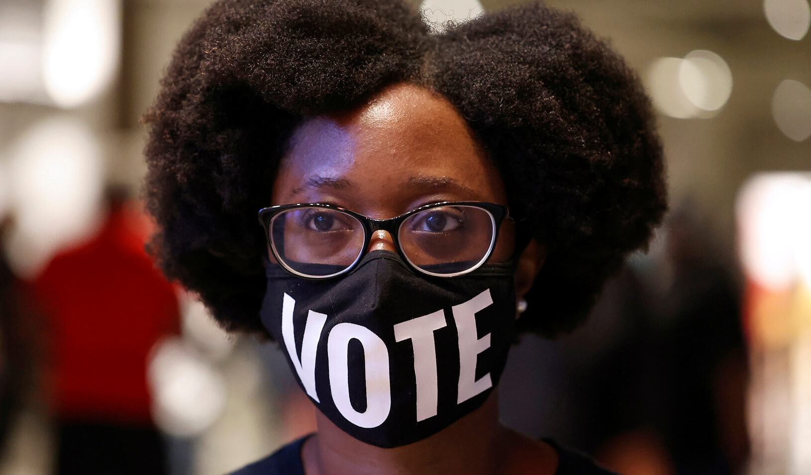 Ashley Nealy waits in line to cast her ballot during early voting for the upcoming presidential elections in Atlanta, Georgia, U.S., October 12, 2020. Credit: REUTERS/Chris Aluka Berry