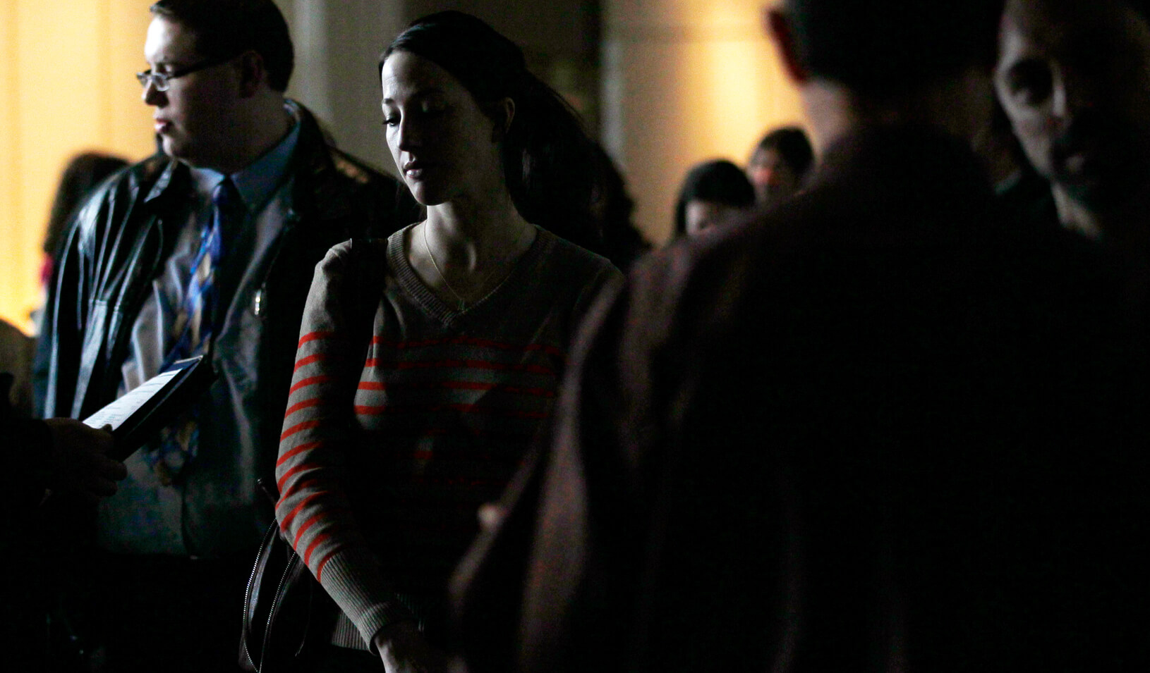 A job seeker waits to talk to a recruiter. | Reuters/Rick Wilking