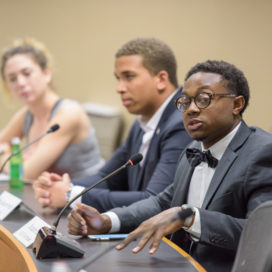 ASSU vice-president Brandon Hill speaks at the close of the penultimate faculty senate meeting this year (Courtesy of Stanford News Service).
