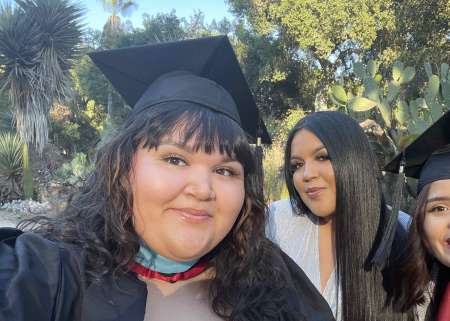 Photo of three STEP students in graduation caps and gowns