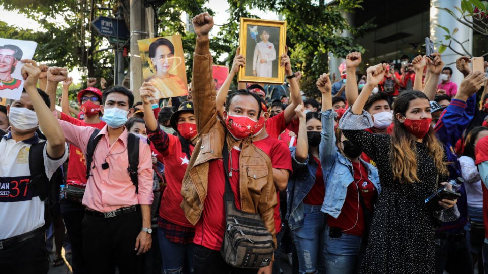 People holding up images in protest