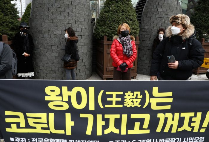 Protesters participate in a rally oppose a planned visit by Chinese Foreign Minister Wang Yi near the Chinese Embassy on November 25, 2020 in Seoul, South Korea.