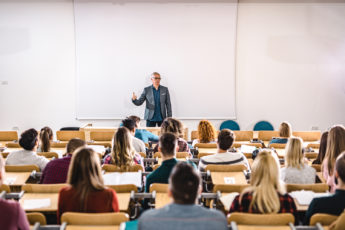 High school class in large lecture hall.