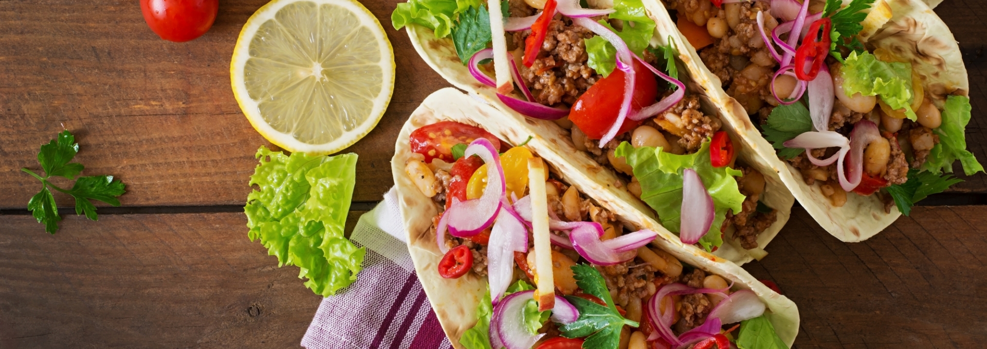 Mexican tacos with meat, beans and salsa. Top view