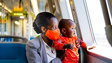 A mother and child on board a new BART train.
