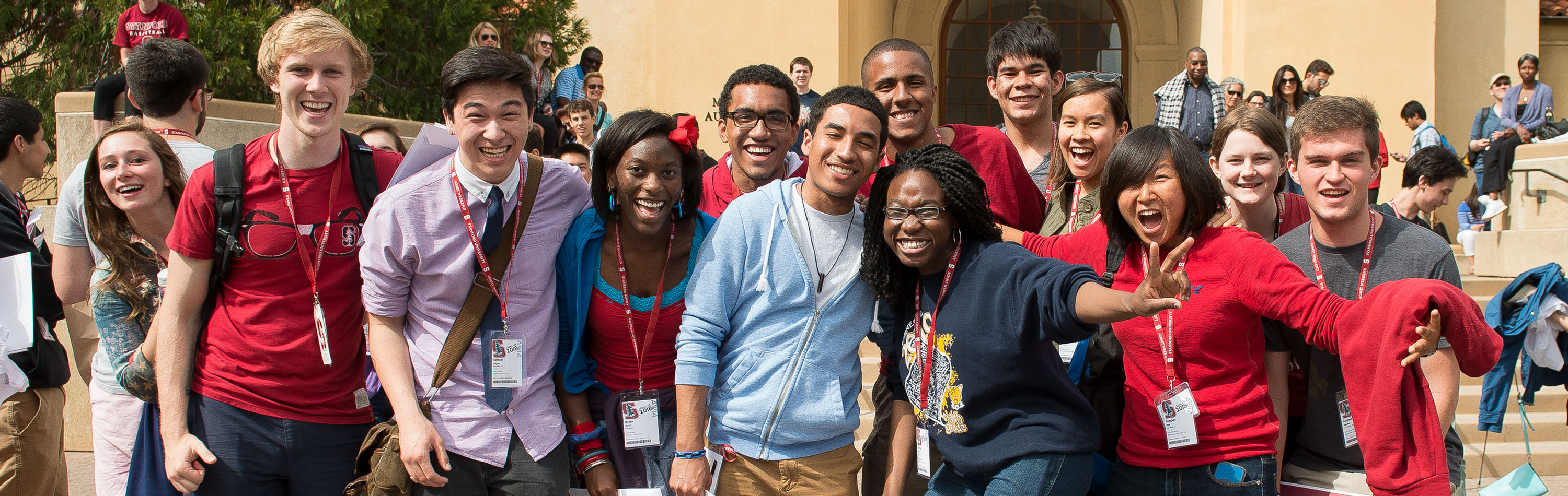 Crowd of students hugging and smiling