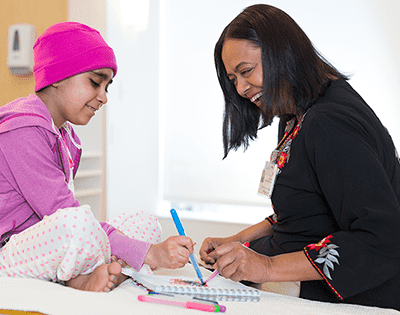 Rajni Agarwal, MD, with patient in the Bass Center